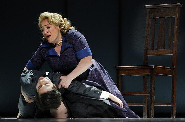 The Governess (Patricia Racette) holds Miles (Michael Kepler Meo) in Los Angeles Opera's new production of Benjamin Britten's "The Turn of the Screw," conducted by James Conlon.