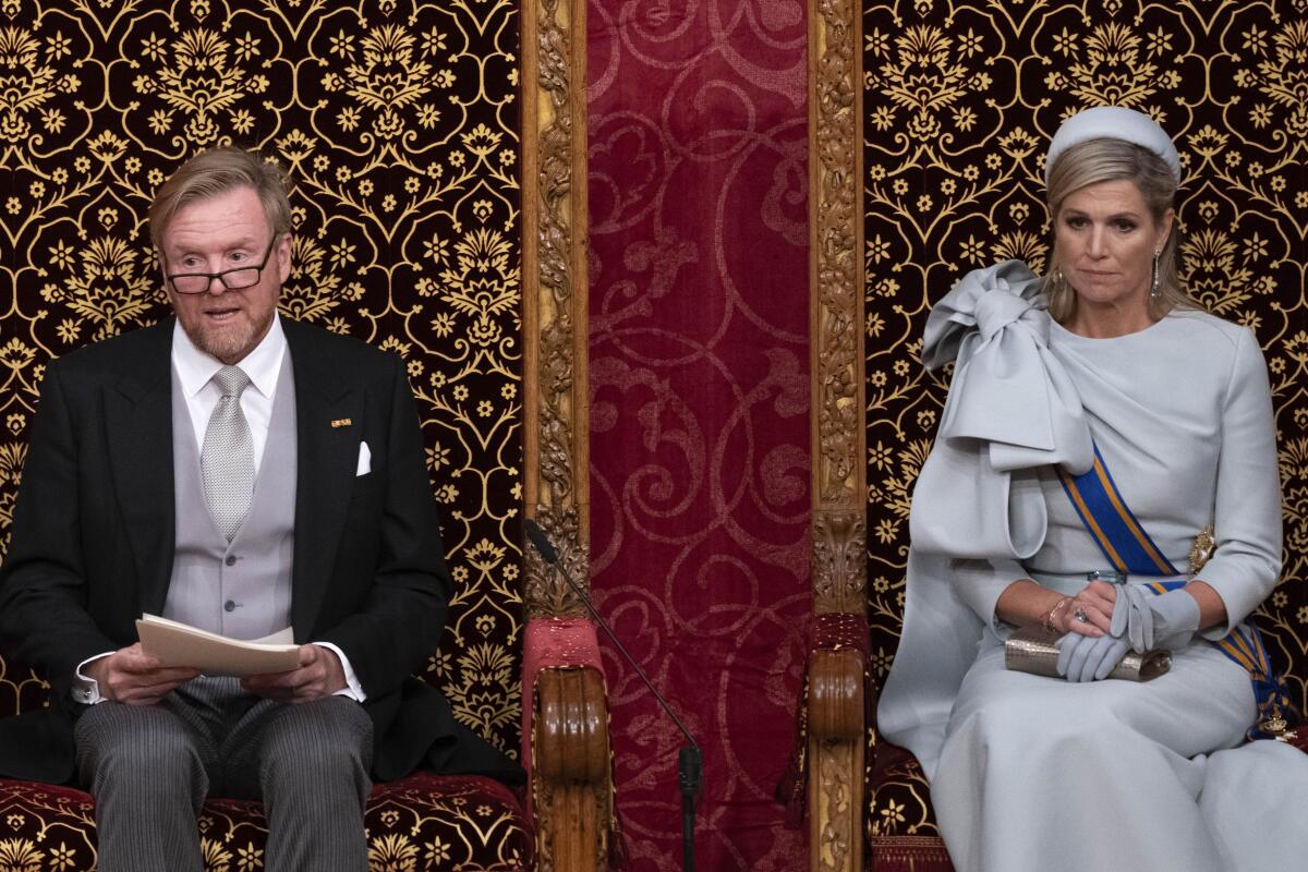 Dutch King Willem-Alexander, with Queen Maxima at his side, outlines the new government's policy plans in The Hague.