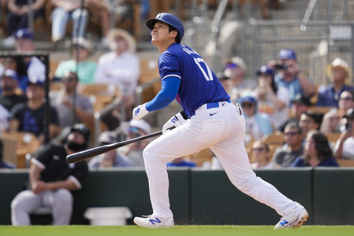 The Dodgers' Shohei Ohtani watches his home run against the White Sox on Tuesday.