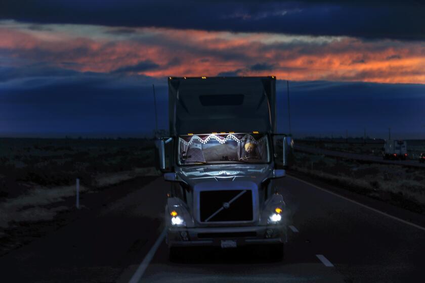 MILAN, NM DECEMBER 07, 2018 --- Long haul truck driver Palwinder Singh, 38, hauling fresh produce, drives through Milan, New Mexico late evening, on I-40 on the way to Illinois. (Irfan Khan / Los Angeles Times)