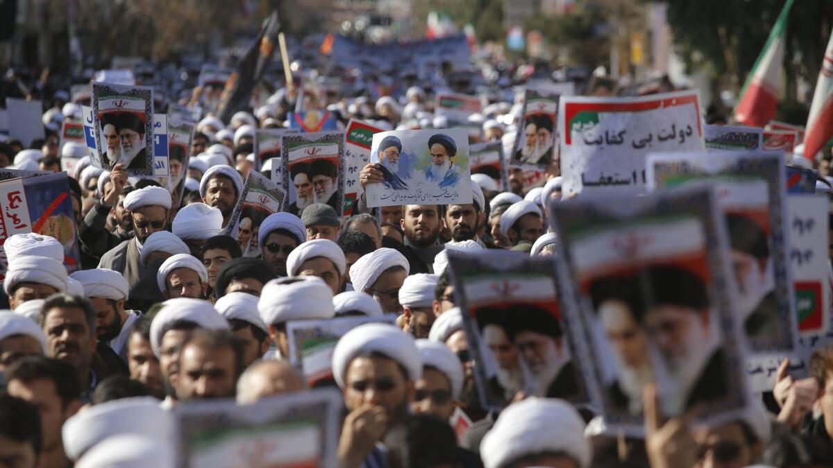 Iranian clerics in the city of Qom take part in a Jan. 3 state-organized rally against anti-government protests.