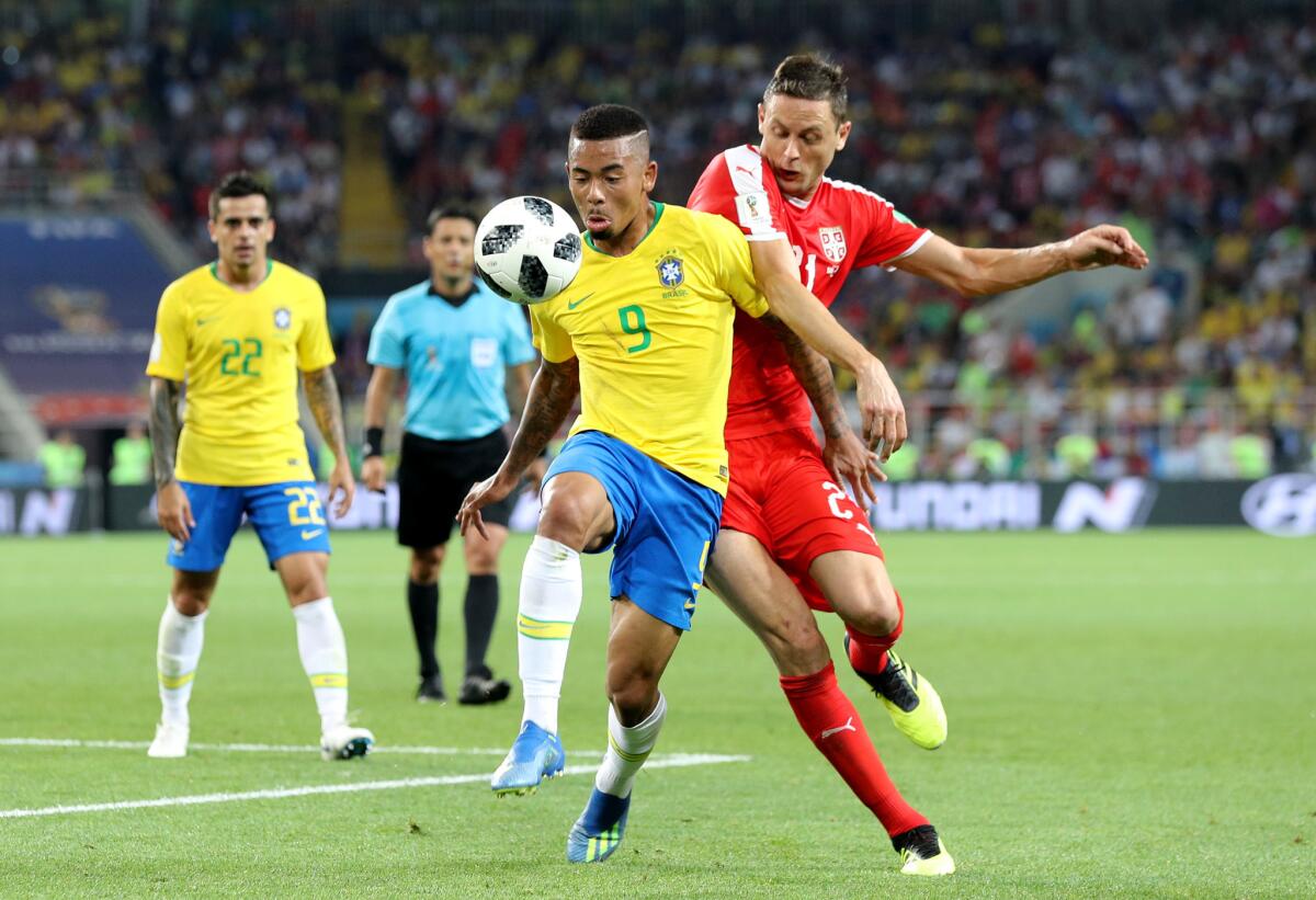 Brazil's Gabriel Jesus and Serbia's Nemanja Matic battle for the ball.