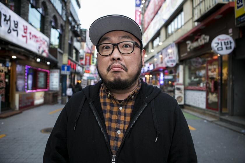 Danny Cho, Korean-American stand-up comedian poses in the street of Shinchon, the downtown of Seoul on January 17, 2020 in South Korea. // Photo by Woohae Cho for The LA TImes