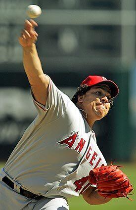 Los Angeles Angels' Bartolo Colon releases a pitch against the Oakland Athletics in the first inning en route to earning his 21st win of the season.
