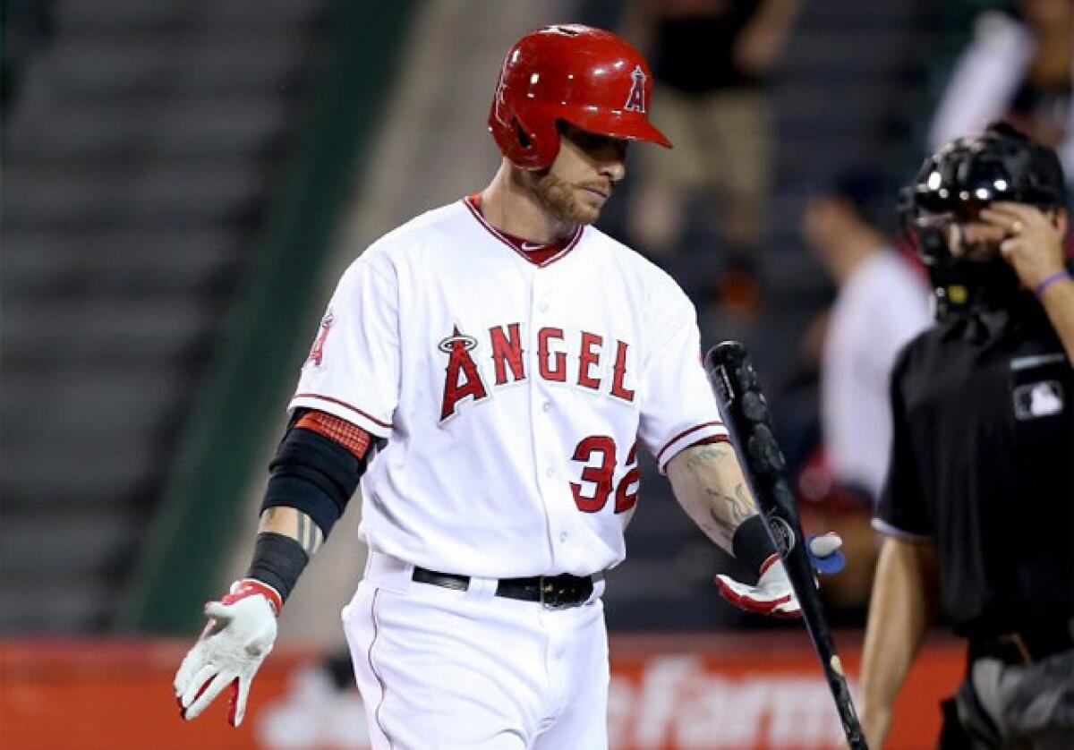 Angels' Josh Hamilton tosses his bat after striking out against the Baltimore Orioles.