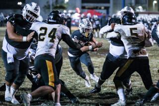 Damian Cornejo of Garfield runs through hole created by his linemen against San Pedro. He scored three TDs.