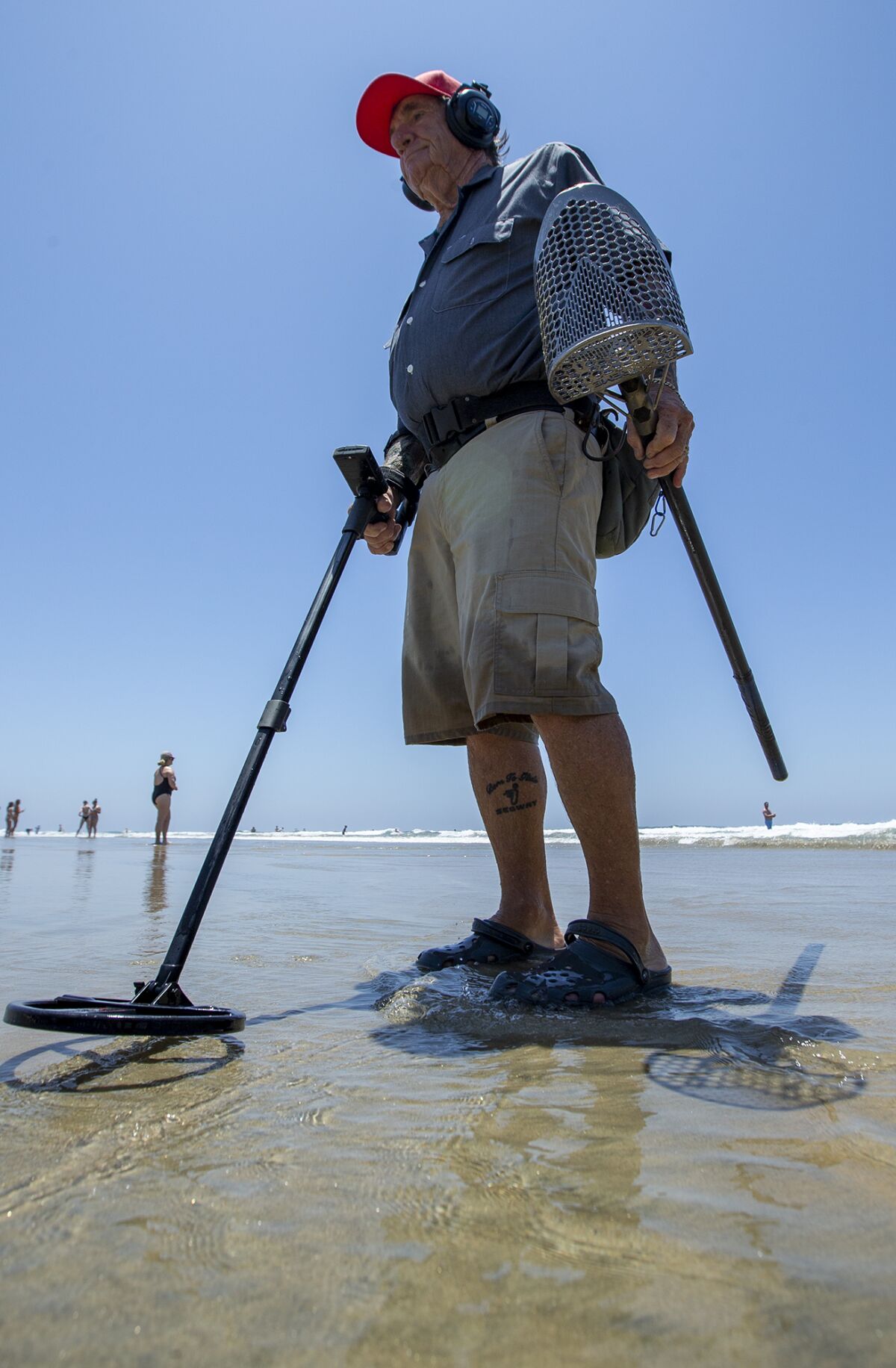 Stan Ross, 79, searches for metal near the Newport Beach Pier.