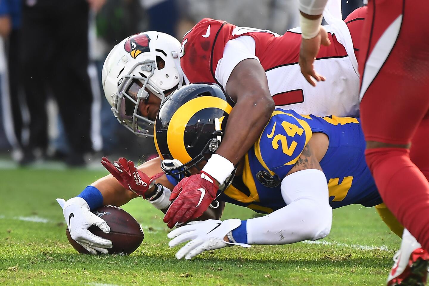Rams safety Taylor Rapp recovers a fumble by Arizona Cardinals running back Kenyan Drake during the second quarter.
