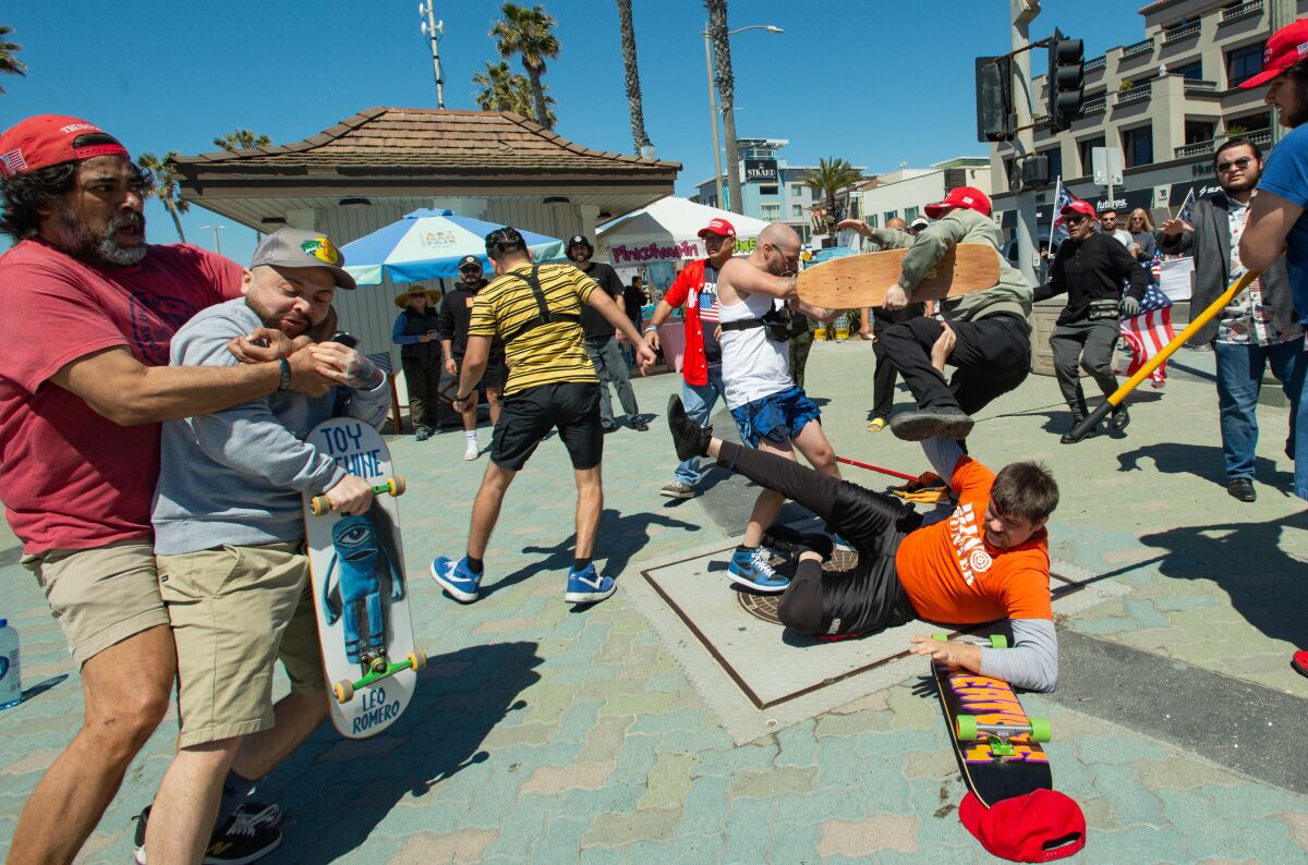 Skateboarders clash with Trump supporters who had gathered in Huntington Beach Saturday.
