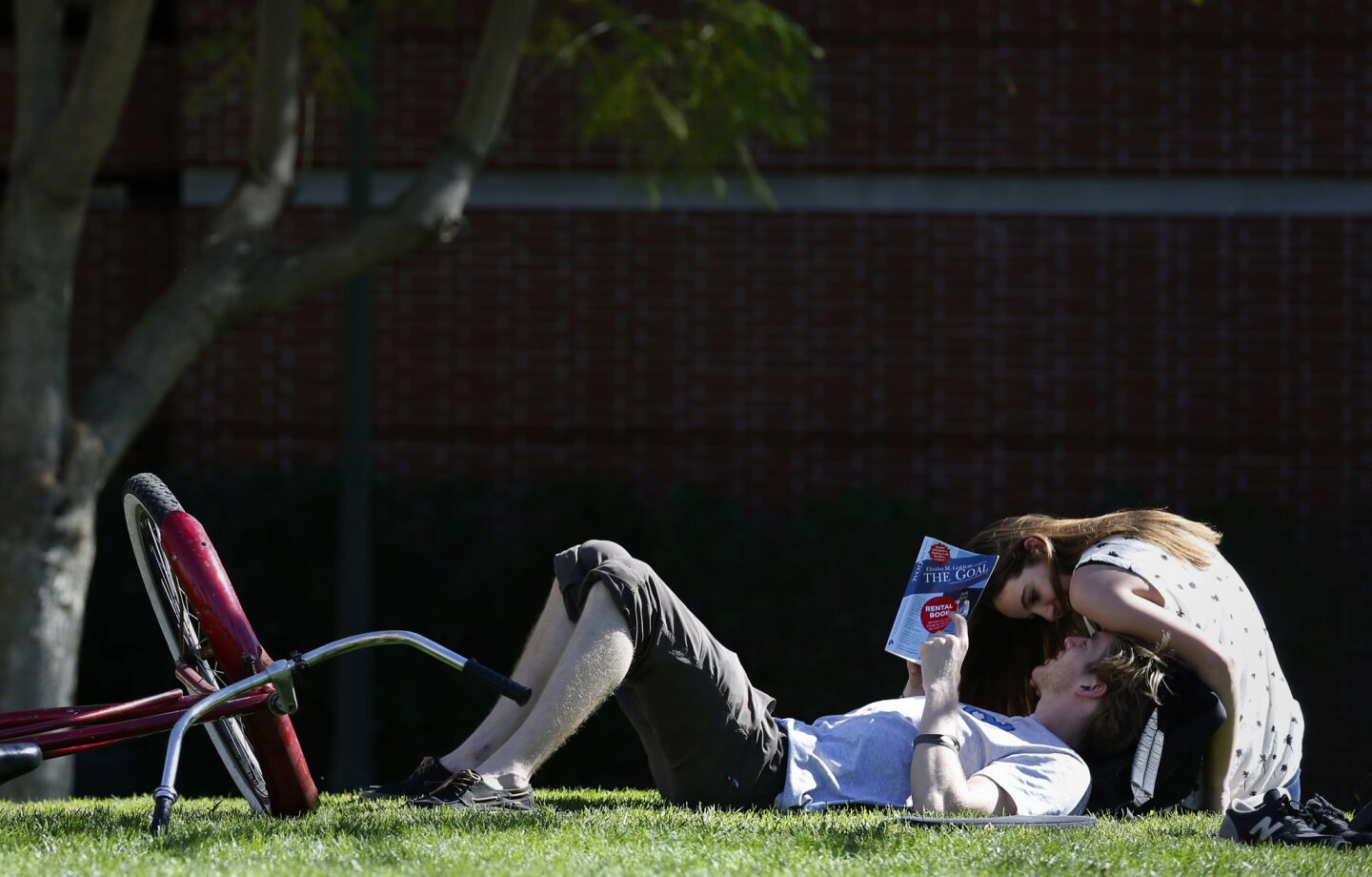 USC students Pat Corcoran and Alexandra Plzak enjoy the warm weather on campus Tuesday as temperatures reached a record 87 degrees in downtown Los Angeles.