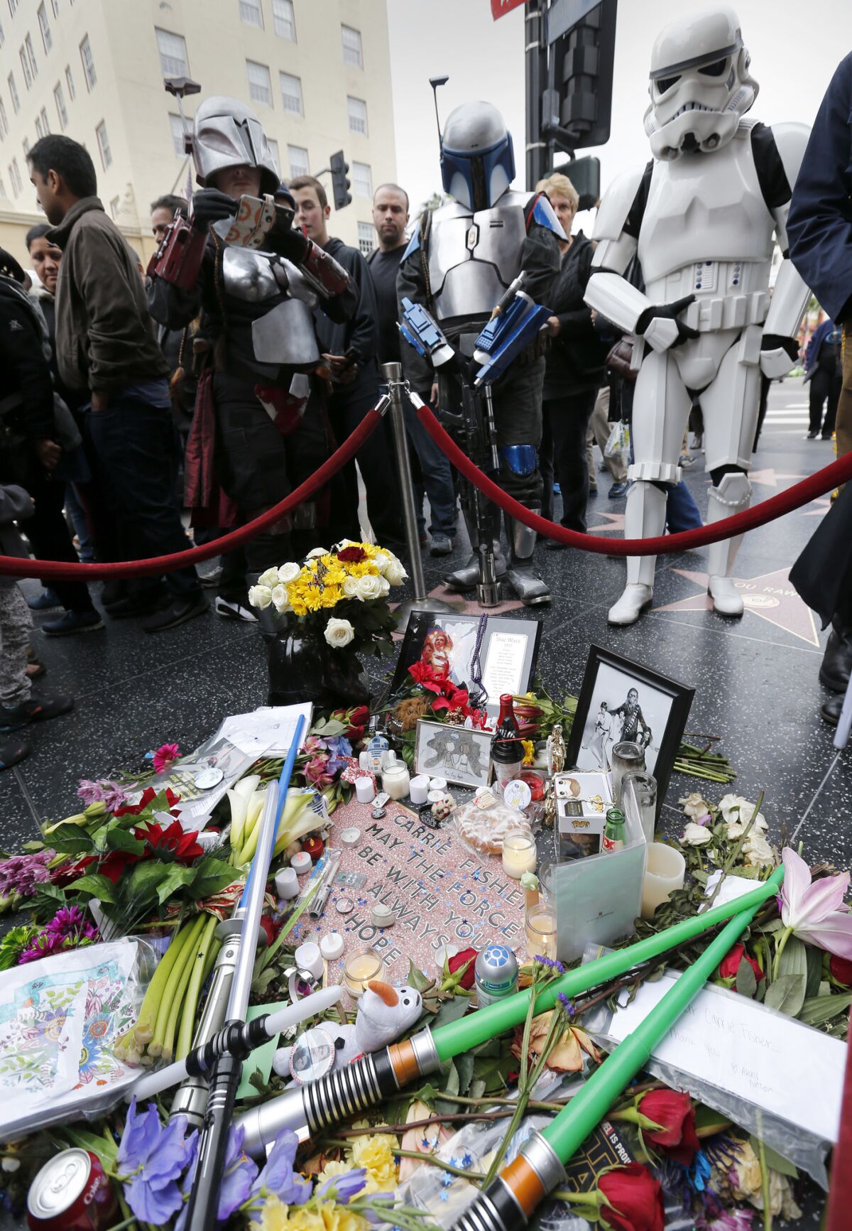 "Star Wars" fans viewed an unmarked star that was dedicated to the memory of actress Carrie Fisher on the Hollywood Walk of Fame on Dec. 31, 2016.