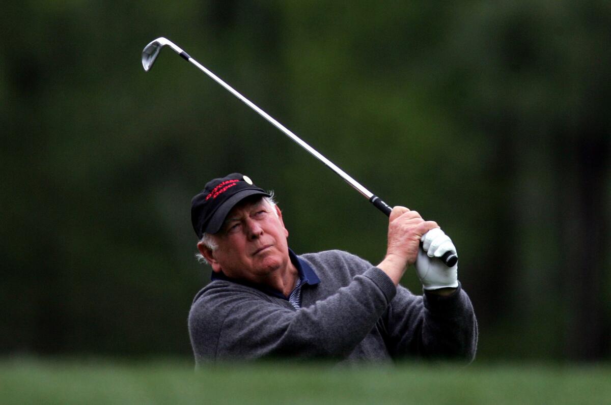 Billy Casper watches his tee shot on No. 12 during The Masters at Augusta National Golf Club in 2005.
