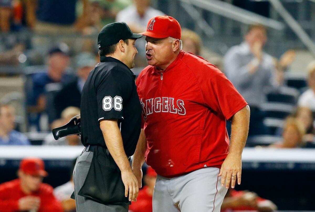 Angels Manager Mike Scioscia argues a call with home plate umpire David Rackley during the sixth inning of the Angels' 14-7 loss to the New York Yankees on Tuesday.