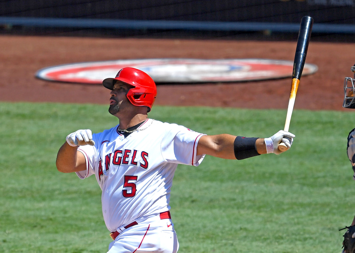 Albert Pujols hits a grand slam during a game.