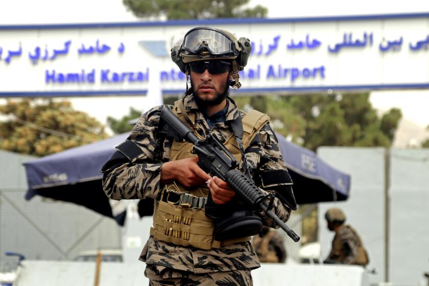 Taliban special force fighters stand guard outside the Hamid Karzai International Airport after the U.S. withdrawal