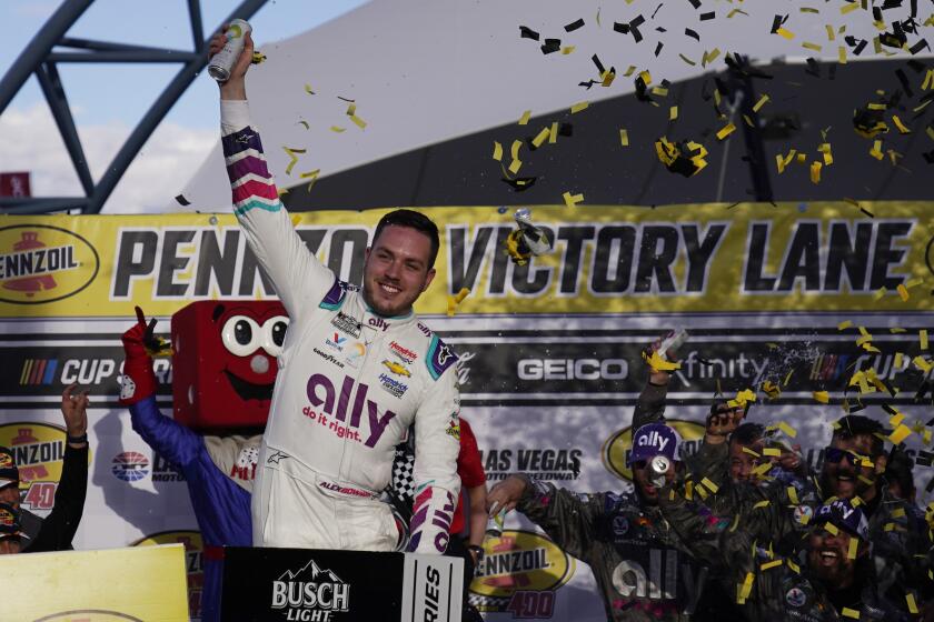 Alex Bowman (48) celebrates after winning a NASCAR Cup Series auto race Sunday.