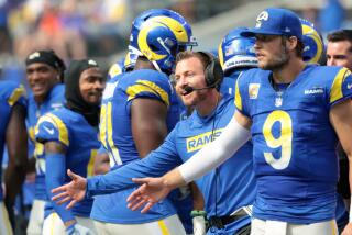 Rams coach Sean McVay and quarterback Matthew Stafford celebrate a defensive touchdown against the Packers.