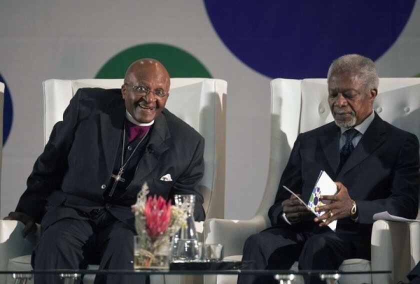 Former U.N. Secretary-General Kofi Annan, right, with Archbishop emeritus Desmond Tutu on Tuesday in Cape Town, South Africa, where Annan called on African leaders to stand by the International Criminal Court.