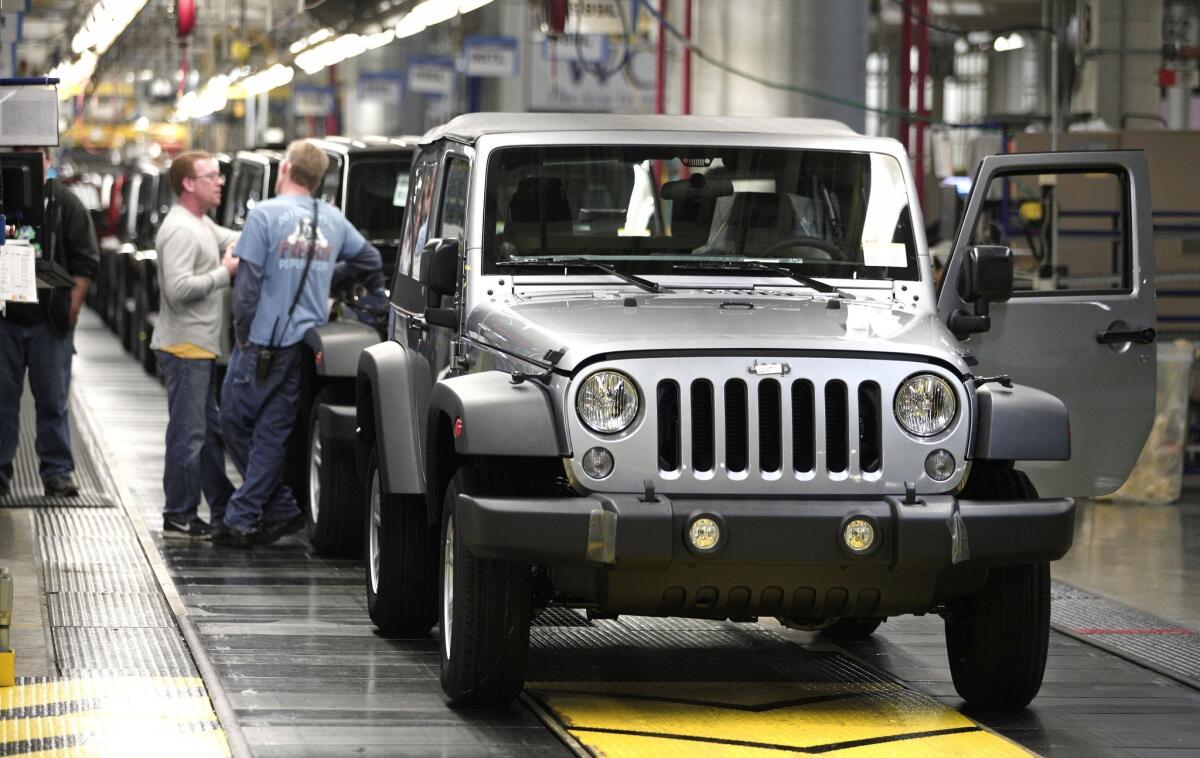 Jeep Wranglers prepare to come off the line after undergoing assembly at the Chrysler Toledo North Assembly Plant in Toledo, Ohio. Fiat Chrysler Automobiles announced it wants to turn Jeep into a global brand as part of an aggressive five-year plan.