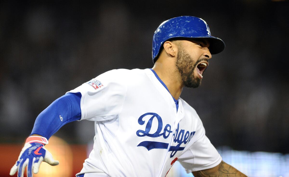Matt Kemp reacts after hitting a go-ahead two-run home run in Game 2 of the National League Division Series on Oct. 4 with the St. Louis Cardinals. Kemp hit .287 with 25 home runs in the regular season for the Dodgers last year.