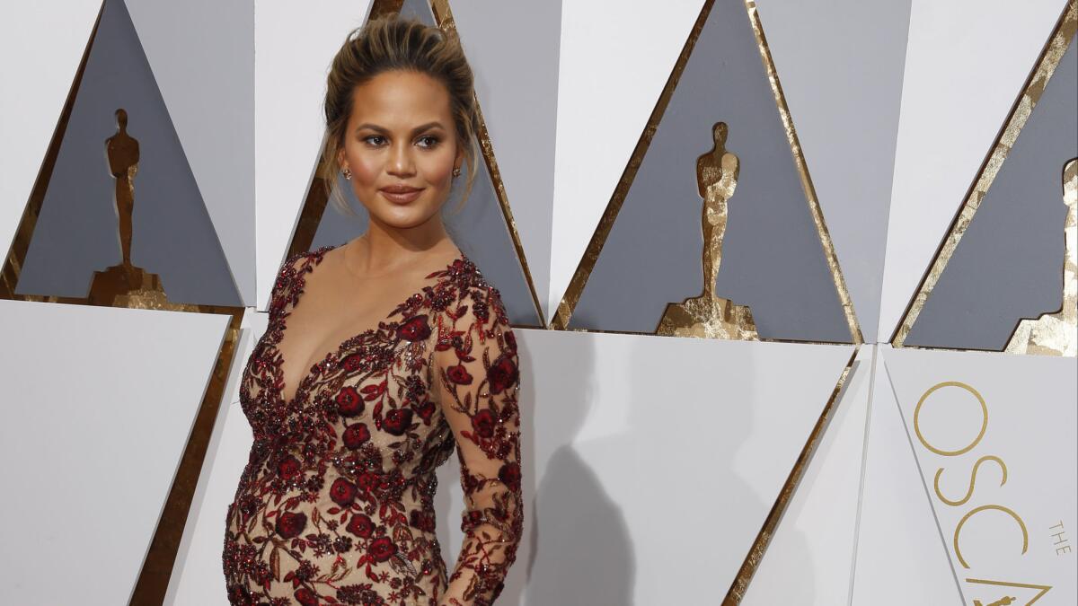 Model Chrissy Teigen explains her latest viral facial expression, which took place at the Oscars.