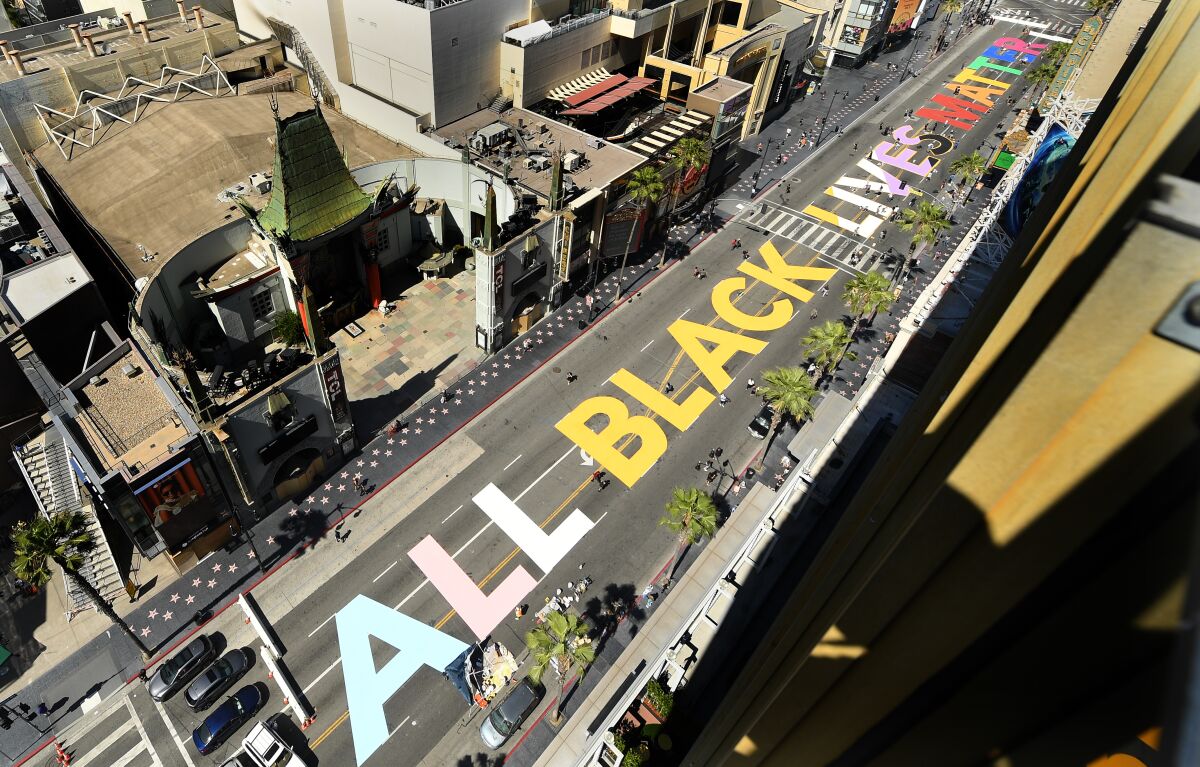 "All Black Lives Matter" is painted on Hollywood Boulevard in front of the TCL Chinese Theatre.