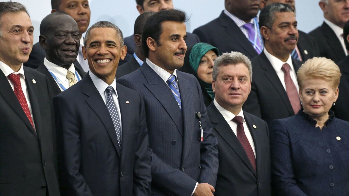 Then-U.S. President Barack Obama, posed with world leaders at United Nations Climate Change Conference, in Le Bourget, outside Paris on Nov. 30, 2015.