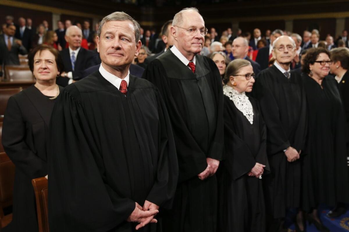 Chief Justice John G. Roberts Jr., front left, will be key to whether or not the Supreme Court can stand up to President Trump.