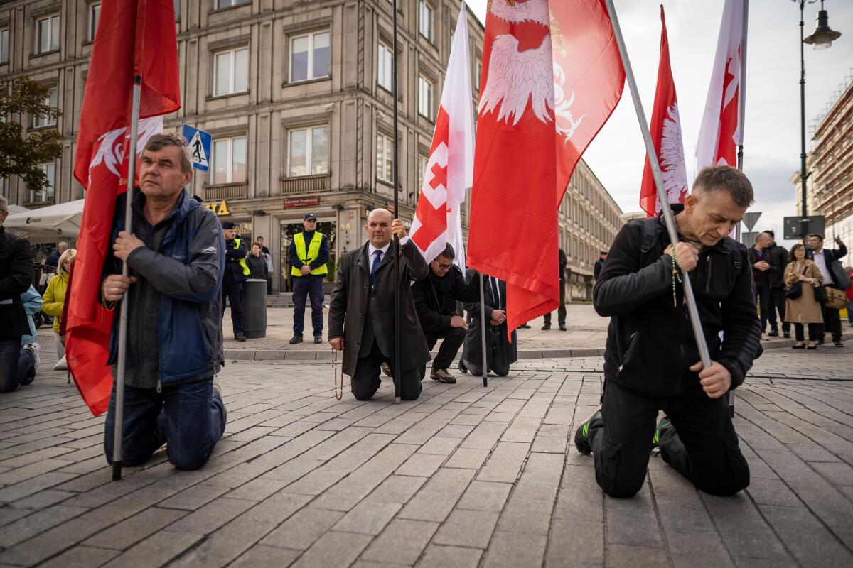 People take part in the National Rosary March on Oct. 5 in Warsaw, where they pray and express opposition to recent lesbian and gay pride parades.