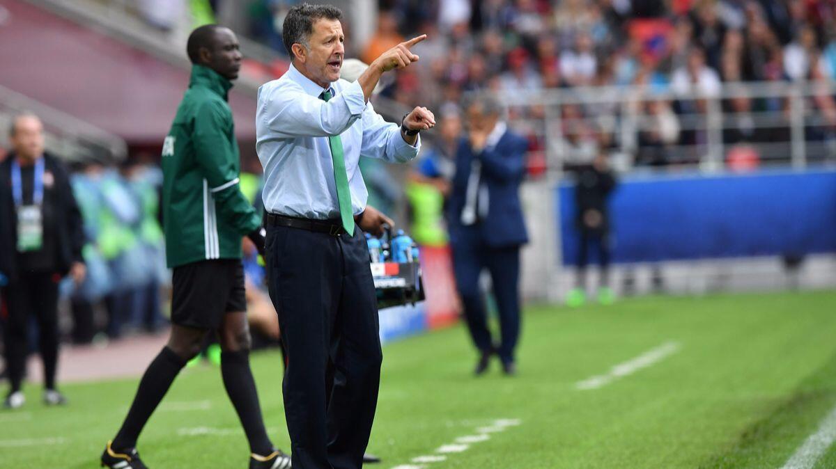 Mexico Coach Juan Carlos Osorio works the sideline during the Confederations Cup's third-place match between Osorio's team and Portugal on July 2 in Moscow.