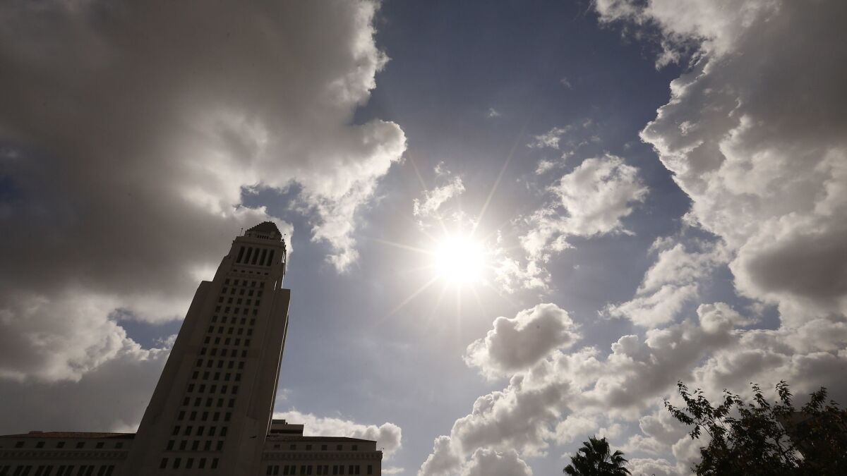 Clouds hover over Los Angeles City Hall in Los Angeles, Calif. on Feb. 12.