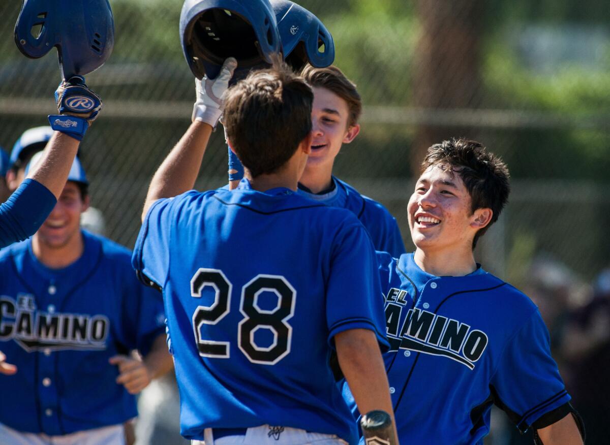 El Camino Real's Eric Yang, right, celebrates after scoring against Narbonne during the City Section semifinals.