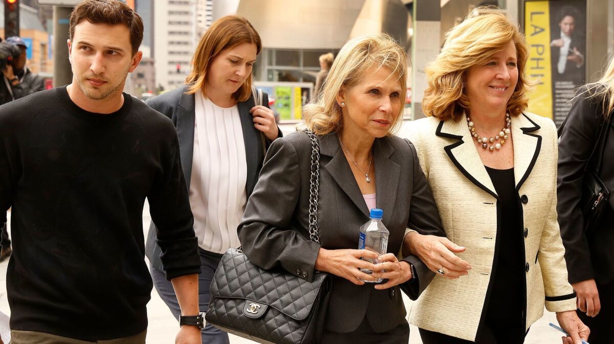 Media mogul Shari Redstone, center, with her son Brandon Korff, left, and her attorney Elizabeth Burnett, right, leaving an L.A. courthouse in May 2016.