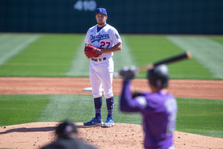 GLENDALE, AZ - MARCH 01: Trevor Bauer #27 of the Los Angeles Dodgers pitches during a spring training game.