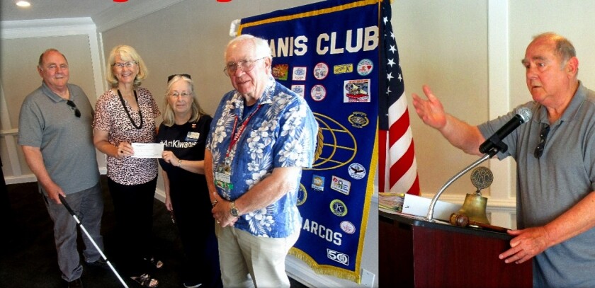 John Forst (left), who is legally blind, and Kim Gibbens, president of San Diego Center for the Blind, received an annual donation from Lake San Marcos Kiwanis Club Secretary Pat Haugen and President Elect Glen Winn. Forst gave an inspirational talk about how he has navigated through his blindness. Gibbens discussed the San Diego Center for the Blind’s mission of “Vision Rehabilitation that Builds Independence.” Gibbens said 100,000 people in the San Diego area are either blind or vision impaired and the center serves these people from two facilities in San Diego and Vista. Photo by Jerry Mason