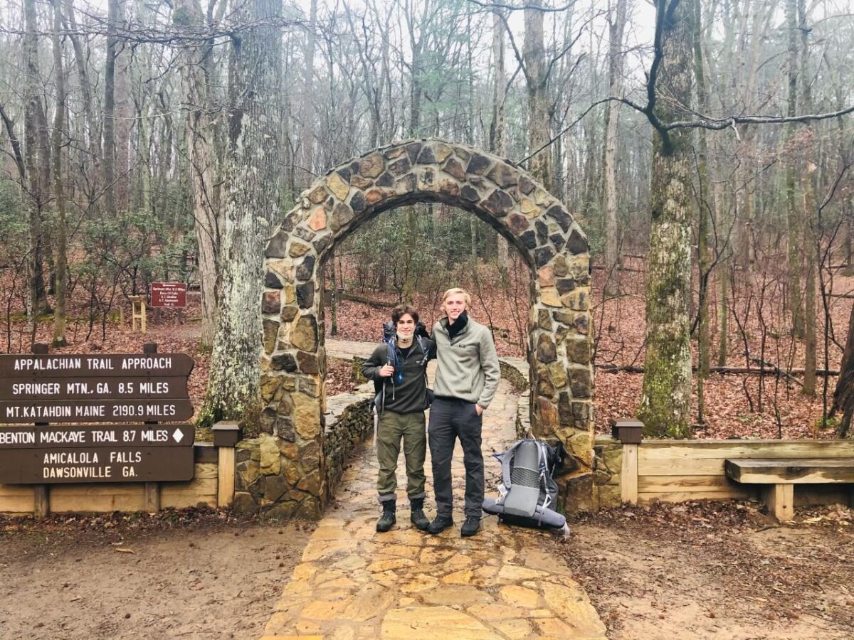 Sammy Potter, 21, and Jackson Parell, 20, stand at the trailhead of the Appalachian Trail in Georgia.