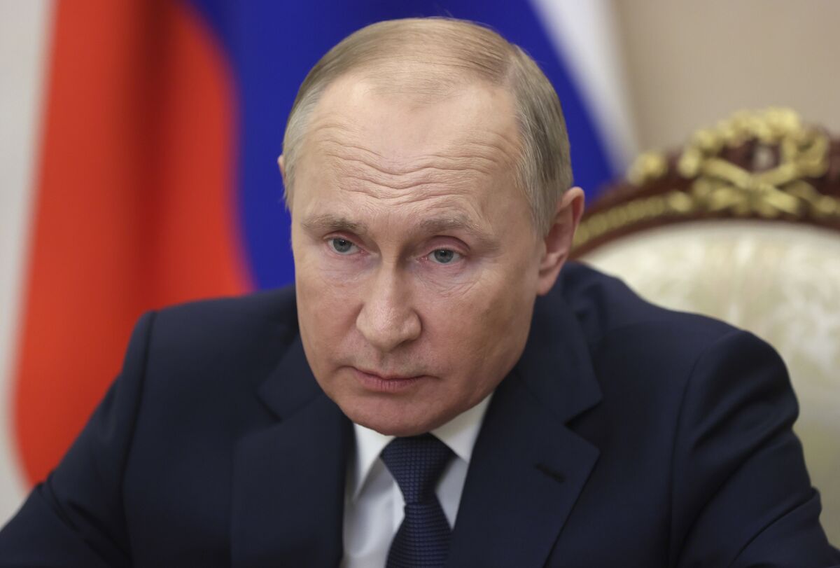 Russian President Vladimir Putin holds a video conference to address participants in a congress of the United Russia party marking the 20th anniversary of the party founding, in Moscow, Russia, Saturday, Dec. 4, 2021. (Mikhail Metzel, Sputnik, Kremlin Pool Photo via AP)