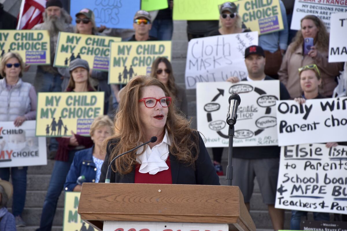 FILE - Superintendent of Public Instruction Elsie Arntzen speaks at a rally opposing mask requirements in schools in front of the state capitol in Helena, Mont., on Oct. 1, 2021. Arntzen was cited on May 26, for illegally passing a school bus in a residential subdivision. She entered a no contest plea to the charge on Wednesday, June 1, 2022 was fined $100 and can have the citation removed from her driving record if she does not have any other driving violations for 60 days. Arntzen has said she does not recall the May 19 incident. (AP Photo/Iris Samuels, File)