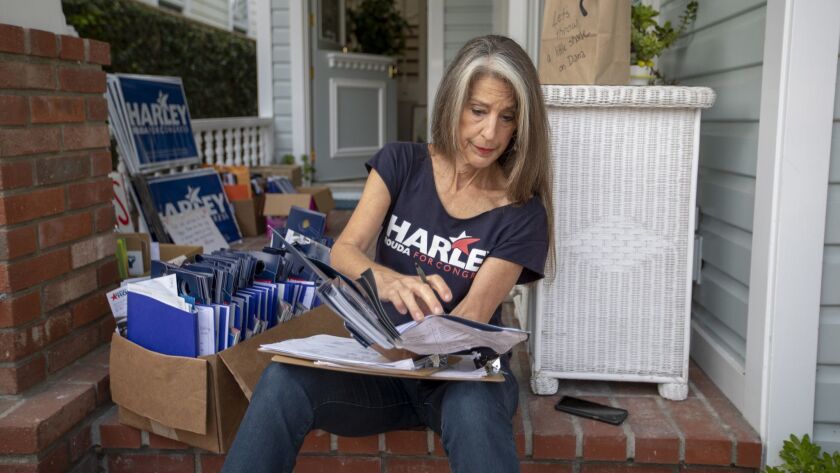 Joni Nichols, a volunteer for Harley Rouda's campaign, has turned her Balboa Island home into a hub for canvassers. She feels that incumbent U.S. Rep. Dana Rohrabacher, a 15-term Republican, is out of step with his constituents, including his belief that climate change is a hoax.