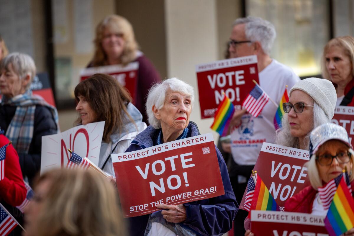 Former Huntington Beach Mayor Shirley Dettloff, center, joins Protect Huntington Beach during a protest on Jan. 16.