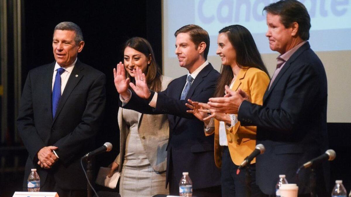 Five Democrats hoping to replace Rep. Darrell Issa, from left: Doug Applegate, Sara Jacobs, Mike Levin, Christina Prejean and Paul Kerr. About $16 million has been spent on the race.