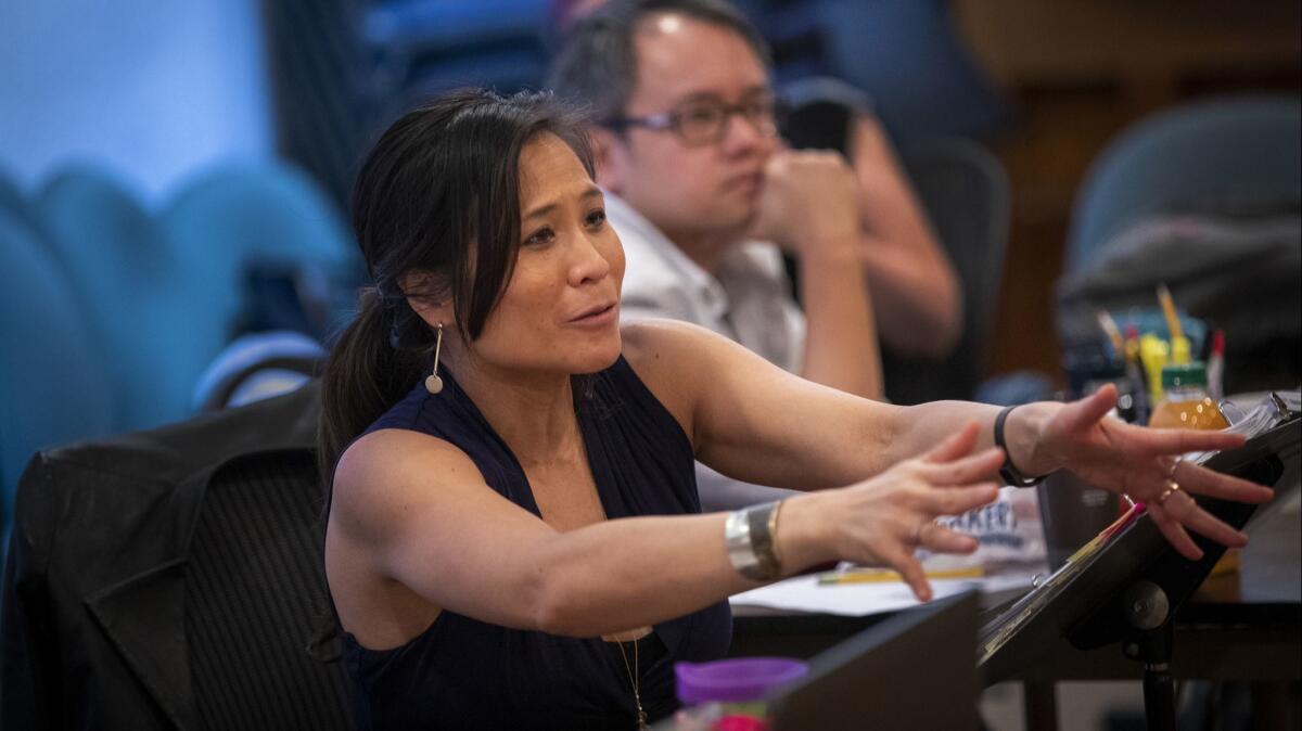 "Poor Yella Rednecks" director May Adrales and Qui Nguyen work with actors rehearsing the play at the South Coast Repertory.