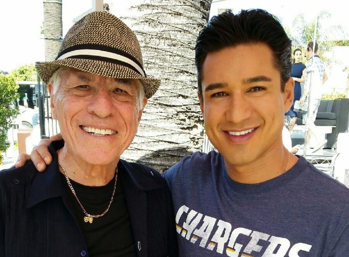 Former teacher and coach William Virchis and Mario Lopez at Universal Studios pre-pandemic.