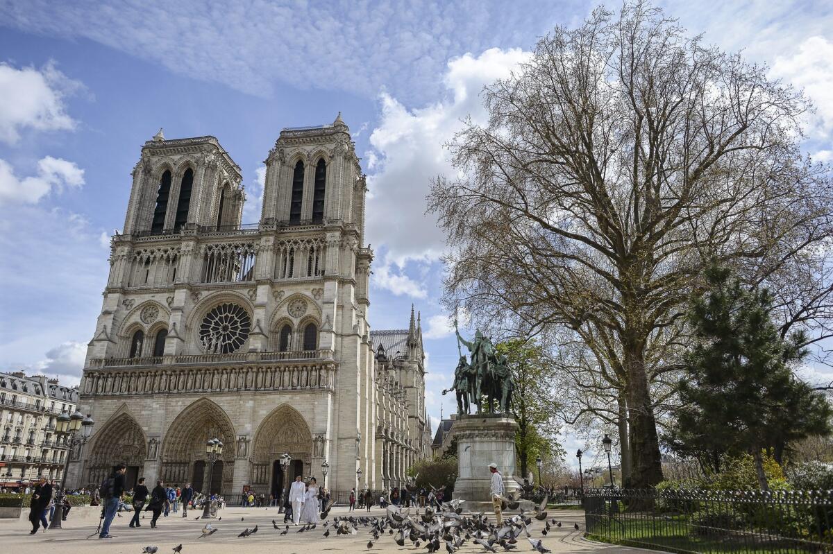 Visit Notre Dame, one of the most famous landmarks in Paris, on a weeklong trip to the French capital that won't break the budget.