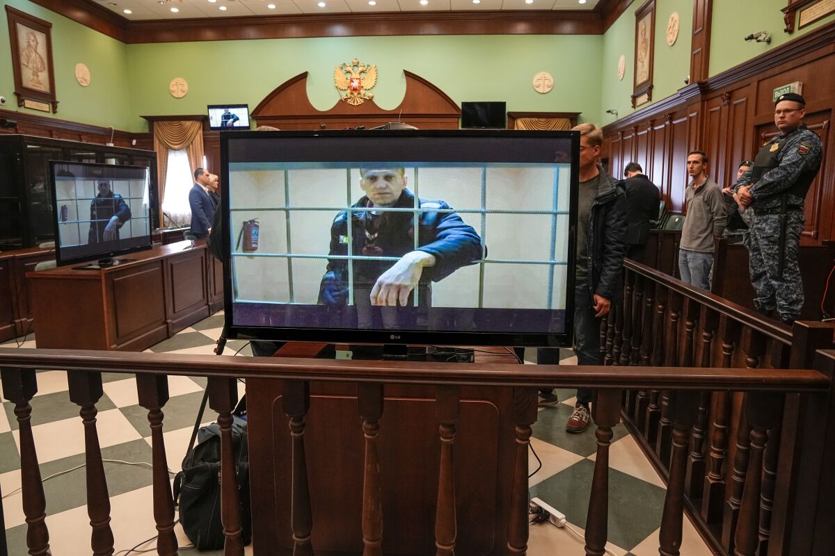 Russian opposition leader Alexei Navalny on screen in a courtroom