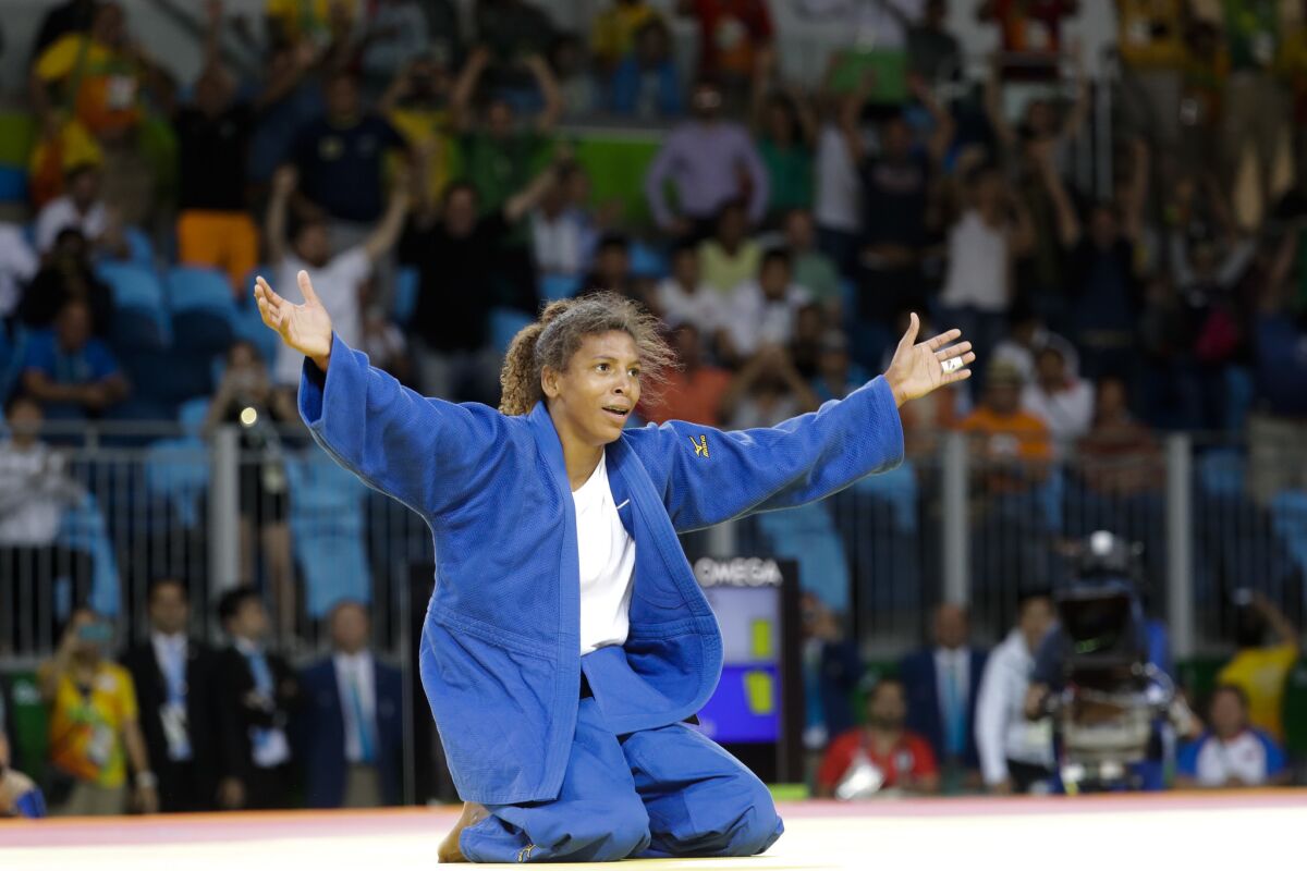 Rafaela Silva celebrates after winning the gold medal of the women's 57-kg judo competition in Rio de Janeiro.