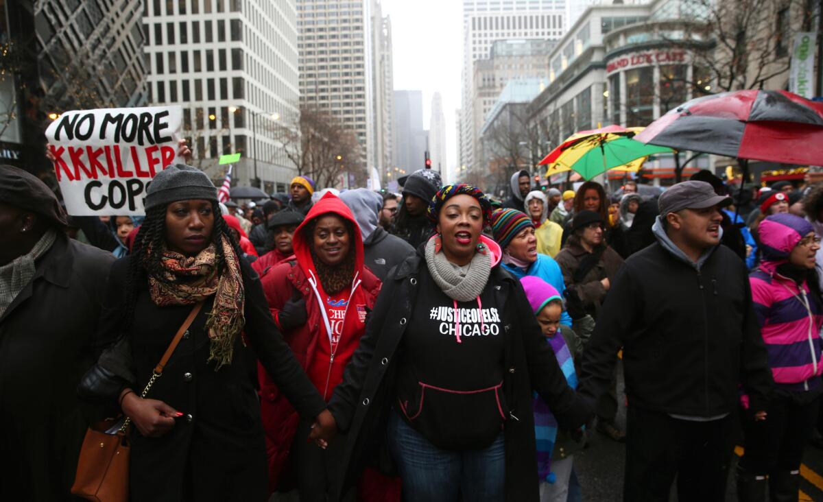People gather during a demonstration in Chicago on Nov. 27, 2015, after the release of a police video showing an officer fatally shooting Laquan McDonald.