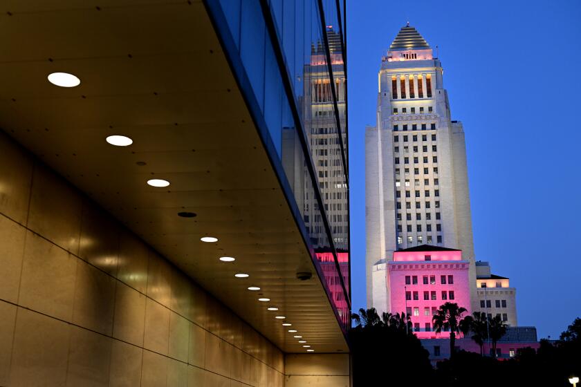 Los Angeles, California April 20, 2023-Los Angeles City Hall is lit up in honor of the passing of former mayor Richard Riordan Thursday night. (Wally Skalij/Los Angeles Times)