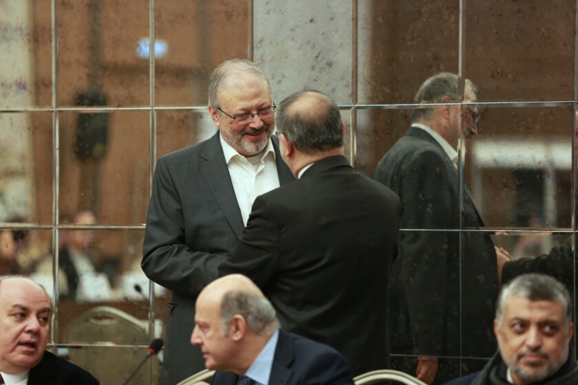 Jamal Khashoggi, right, in the documentary "Kingdom of Silence."