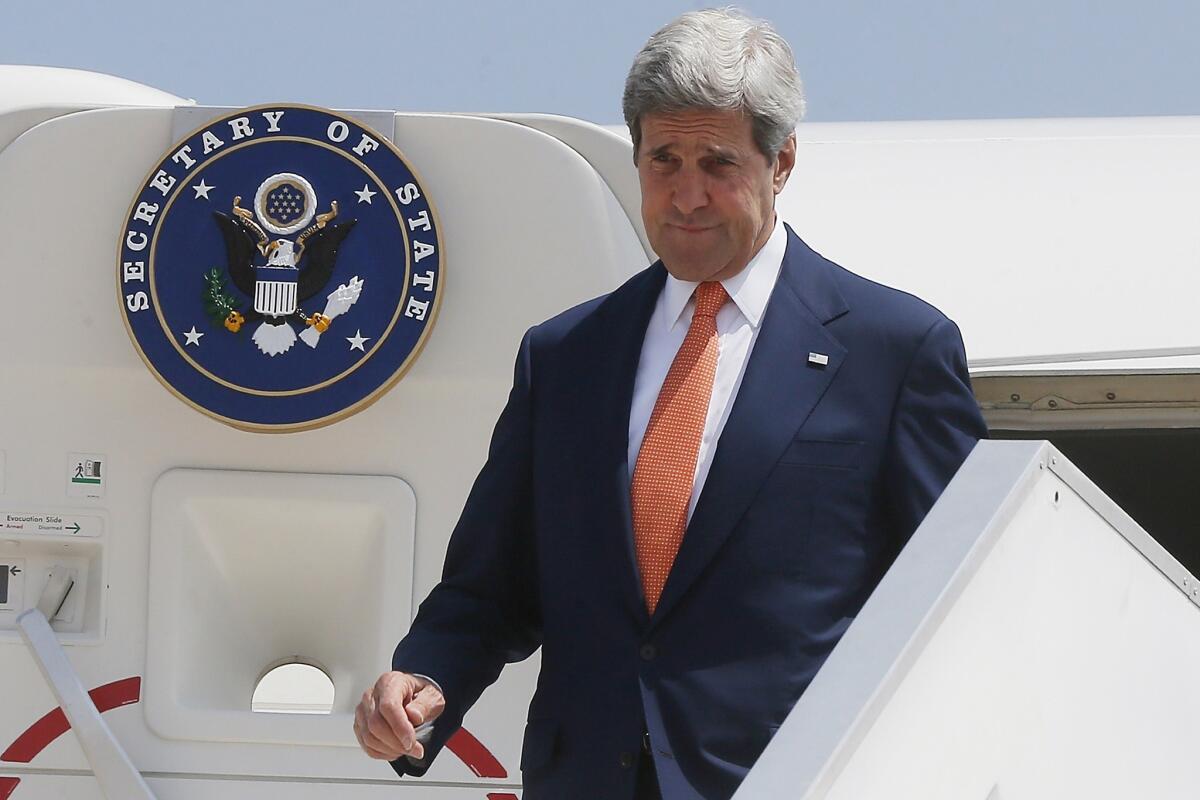 Secretary of State John F. Kerry steps out from his plane at Ben Gurion International Airport as he arrives in Israel on July 23.